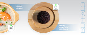 A wooden board with a mound of black rice; split view with seafood porridge labeled on the left.