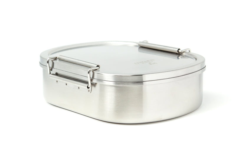 Silver metal lunch box with clamped lid on white background.